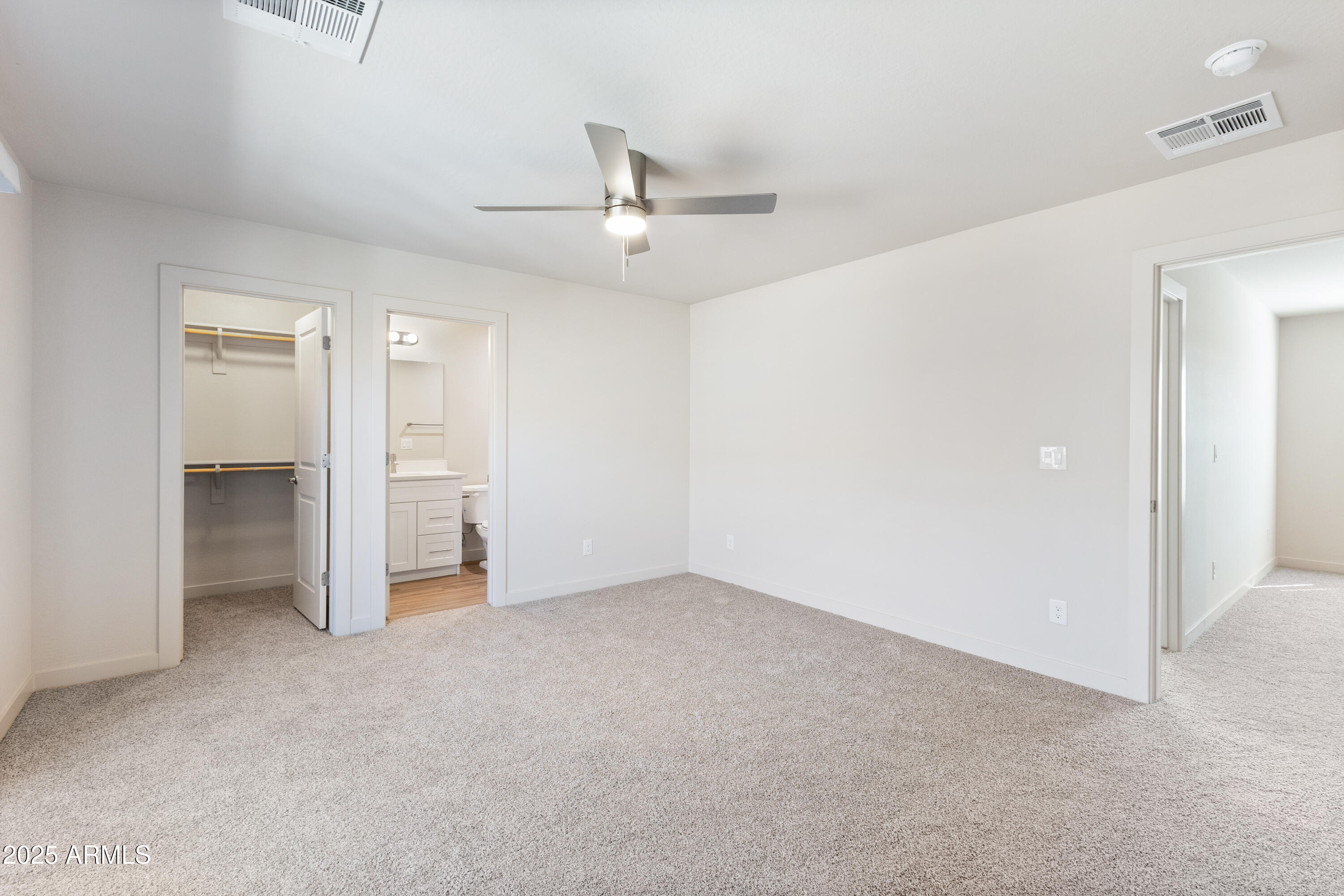 4307 North 13th Place Phoenix, AZ 85014 - Photo 28 of 35 an empty room with closet and a ceiling fan
