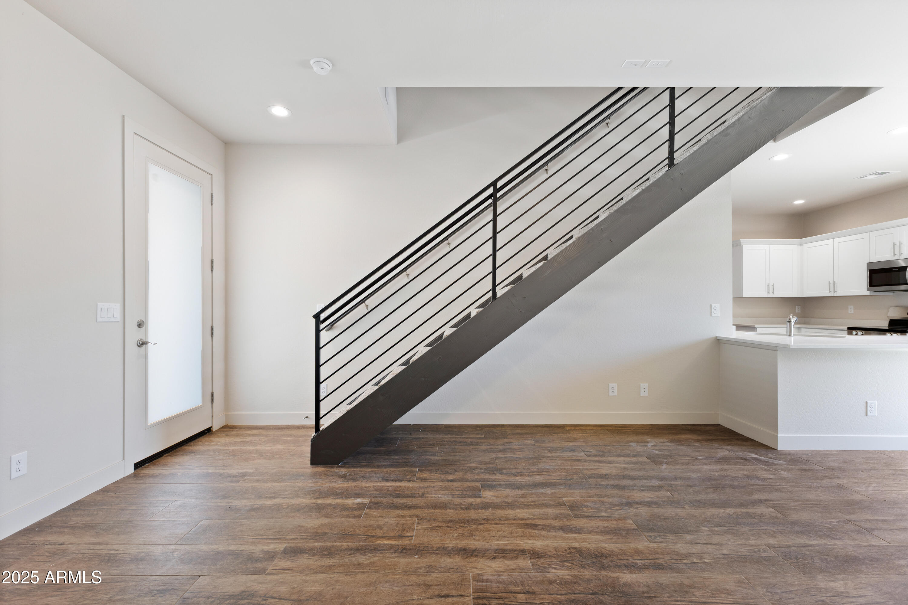 4307 North 13th Place Phoenix, AZ 85014 - Photo 7 of 35 a view of entryway and hall with wooden floor