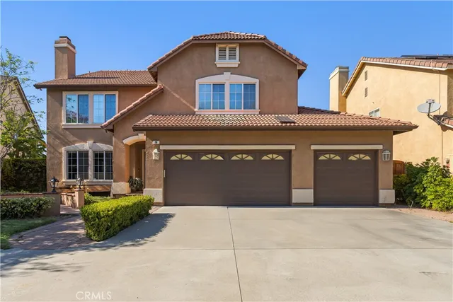 a front view of a house with a garage