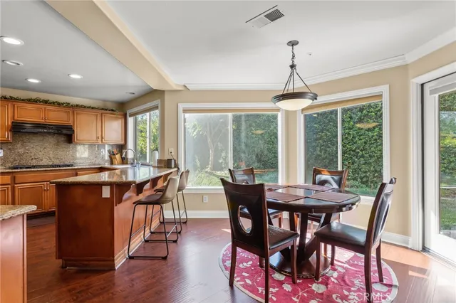 a dining room with furniture window wooden floor