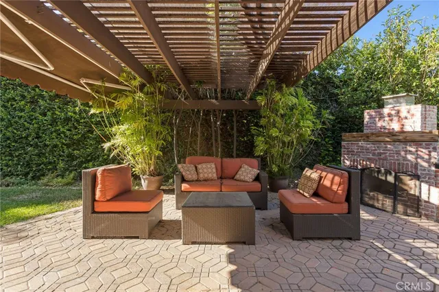 a outdoor living space with patio furniture and garden view