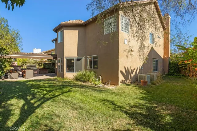 a view of room with wooden floor and flat screen tv