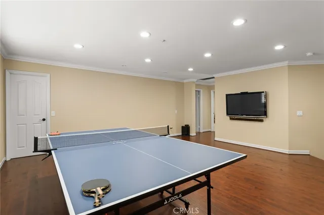 a spacious bedroom with a bed and a chandelier