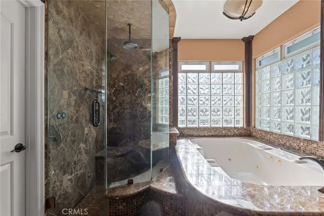 a bedroom with a bed a desk and chair