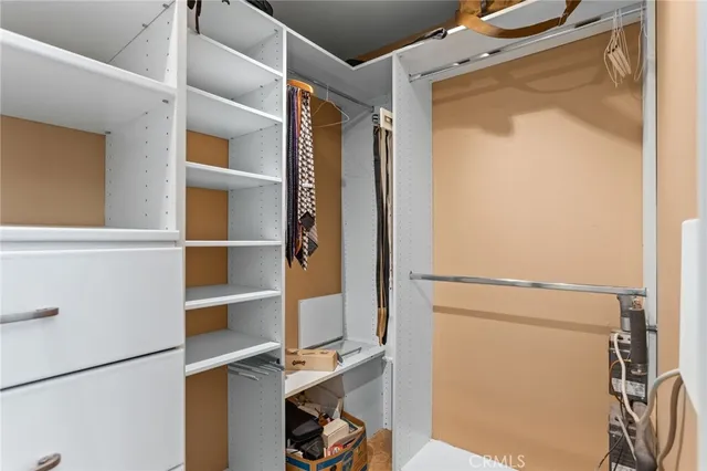 a bedroom with furniture and window