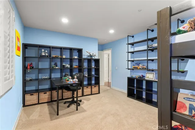 a room with gym equipment and windows