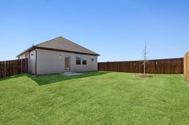 a view of a backyard with potted plants