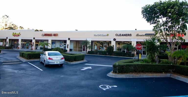 7777 North Wickham Road, Unit 16 Melbourne, FL 32940 - Photo 1 of 1 a car parked in front of a white house