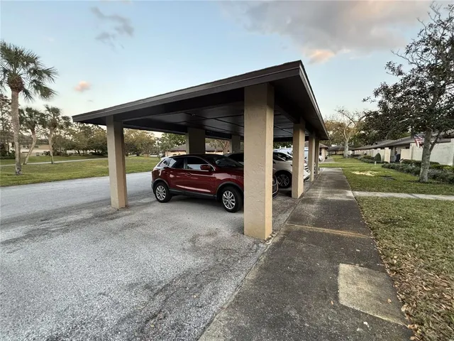 a view of a car parked in front of a house