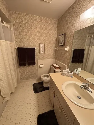 a bedroom with a bed and furniture