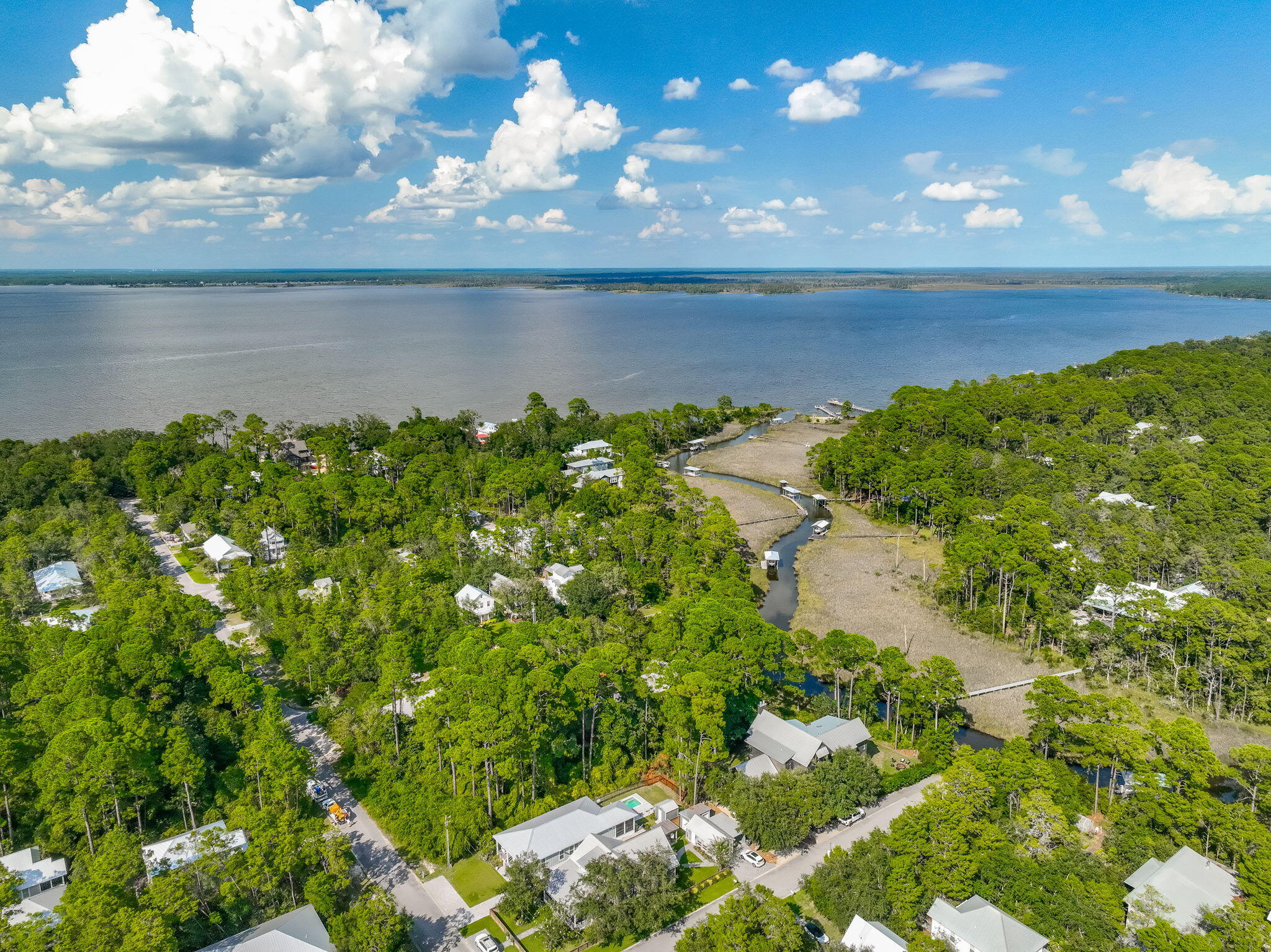 Lot 8 South Magnolia Beach Way Santa Rosa Beach, FL 32459 - Photo 6 of 20 a view of a lake from a yard