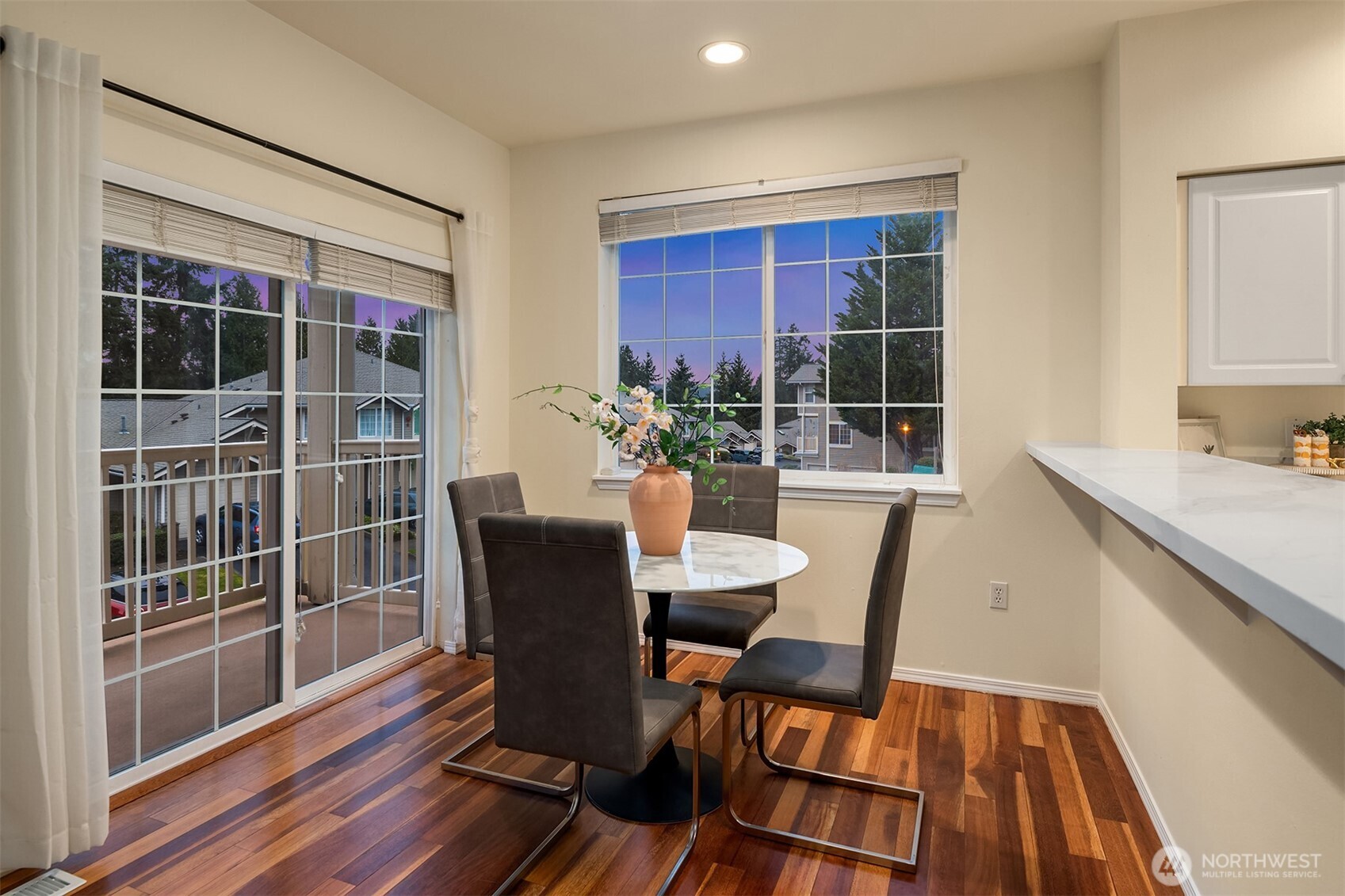 18646 Northeast 57th Way Redmond, WA 98052 - Photo 14 of 40 a view of a dining room with furniture window and wooden floor