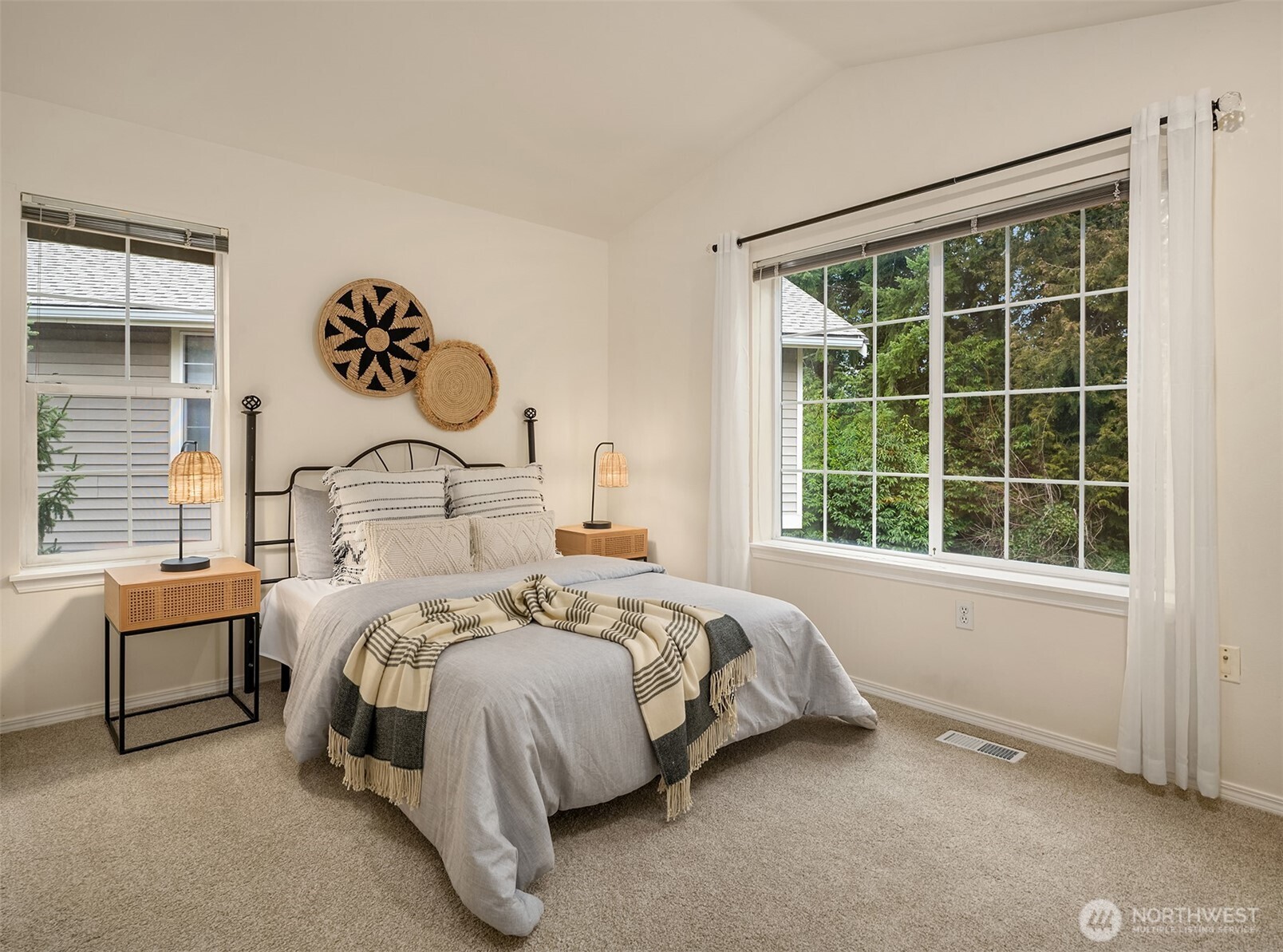 18646 Northeast 57th Way Redmond, WA 98052 - Photo 19 of 40 a bedroom with a bed and a window