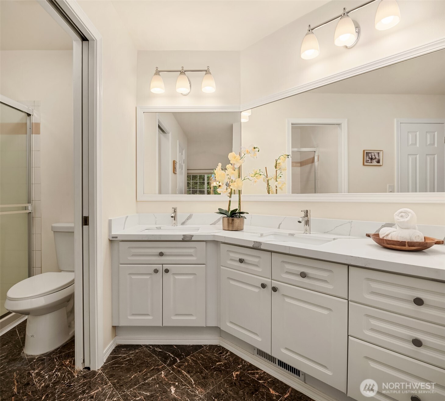 18646 Northeast 57th Way Redmond, WA 98052 - Photo 20 of 40 a spacious bathroom with a granite countertop sink a toilet and a mirror