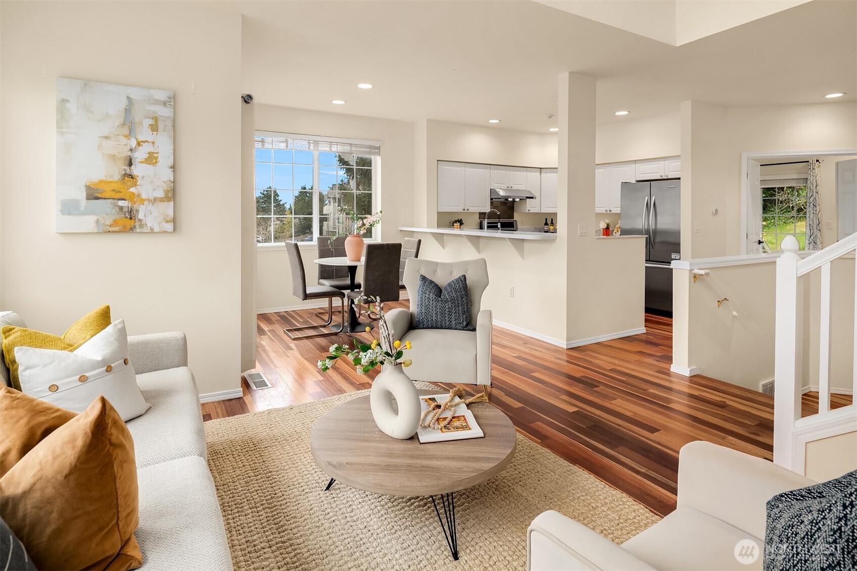 18646 Northeast 57th Way Redmond, WA 98052 - Photo 5 of 40 a living room with furniture kitchen view and a wooden floor