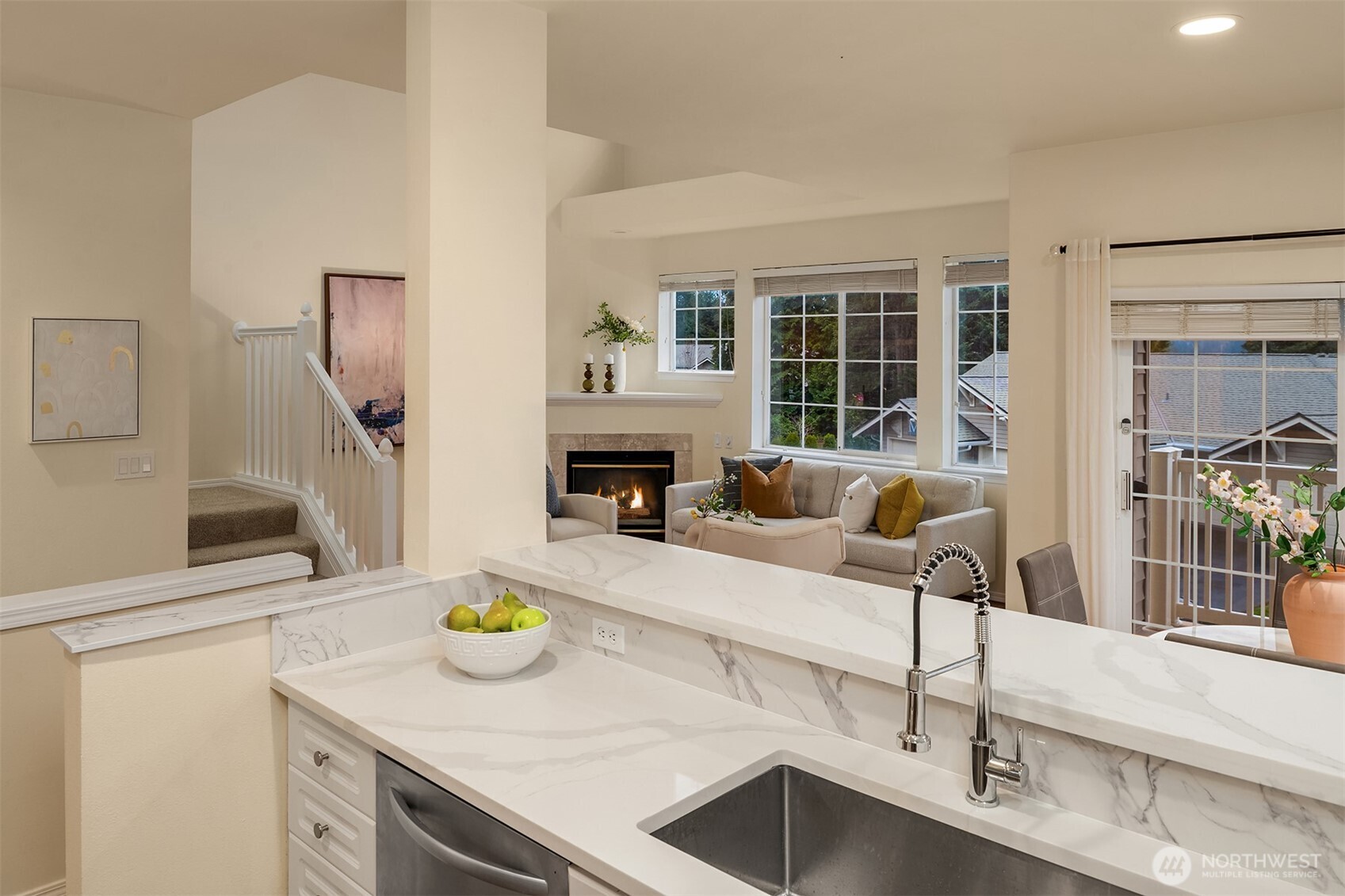 18646 Northeast 57th Way Redmond, WA 98052 - Photo 8 of 40 a kitchen with a sink and a stove with wooden floor