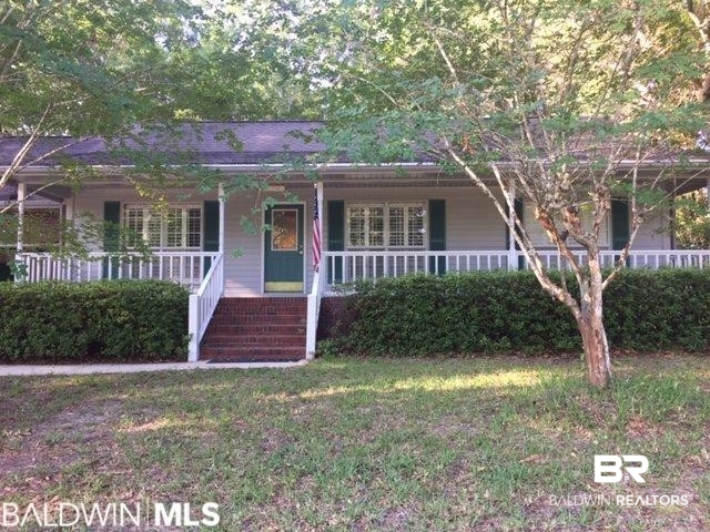 23393 Miflin Road Foley, AL 36535 - Photo 1 of 12 View of front of property featuring covered porch and a front lawn