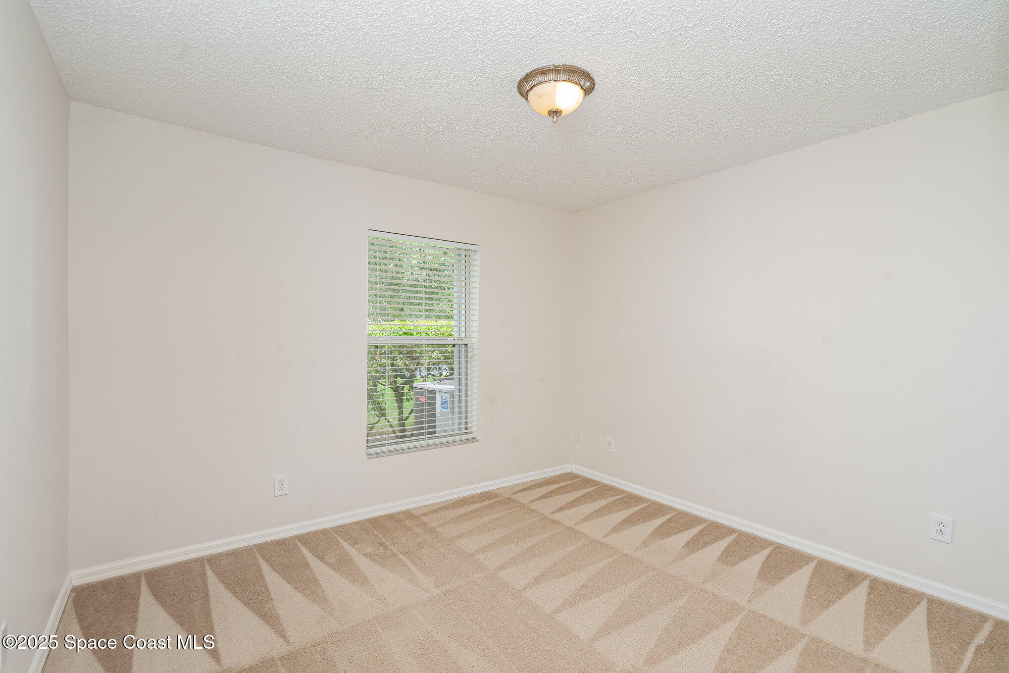 1162 Brumpton Place Rockledge, FL 32955 - Photo 15 of 25 an empty room with a window