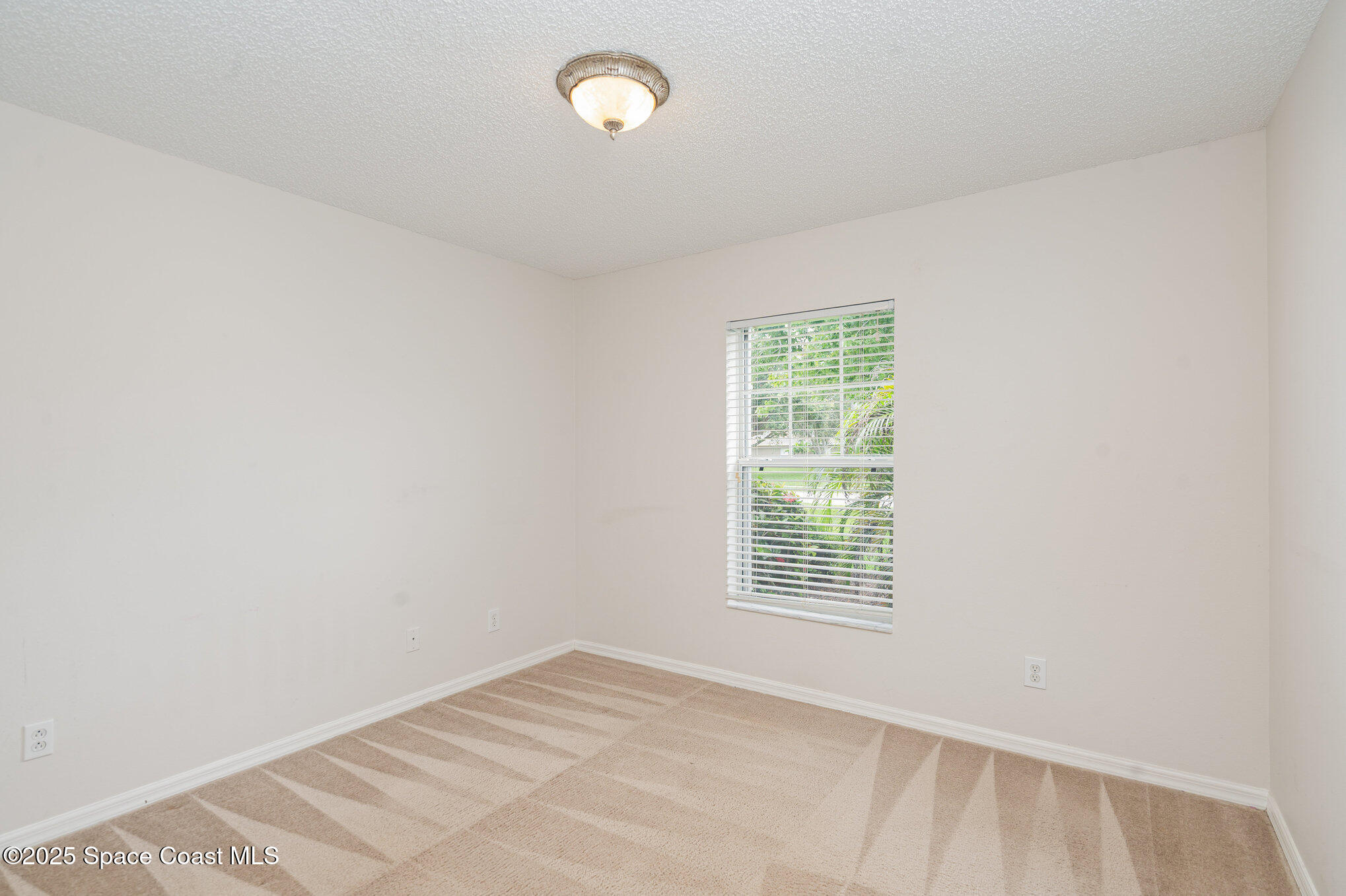 1162 Brumpton Place Rockledge, FL 32955 - Photo 17 of 25 an empty room with windows