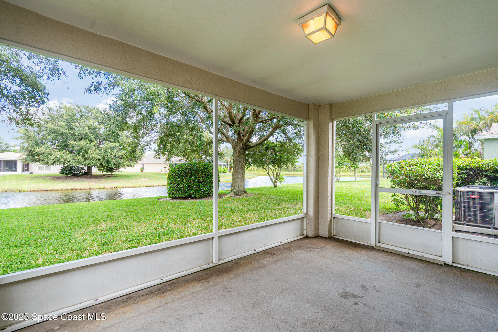 1162 Brumpton Place Rockledge, FL 32955 - Photo 2 of 25 a view of a room with large windows
