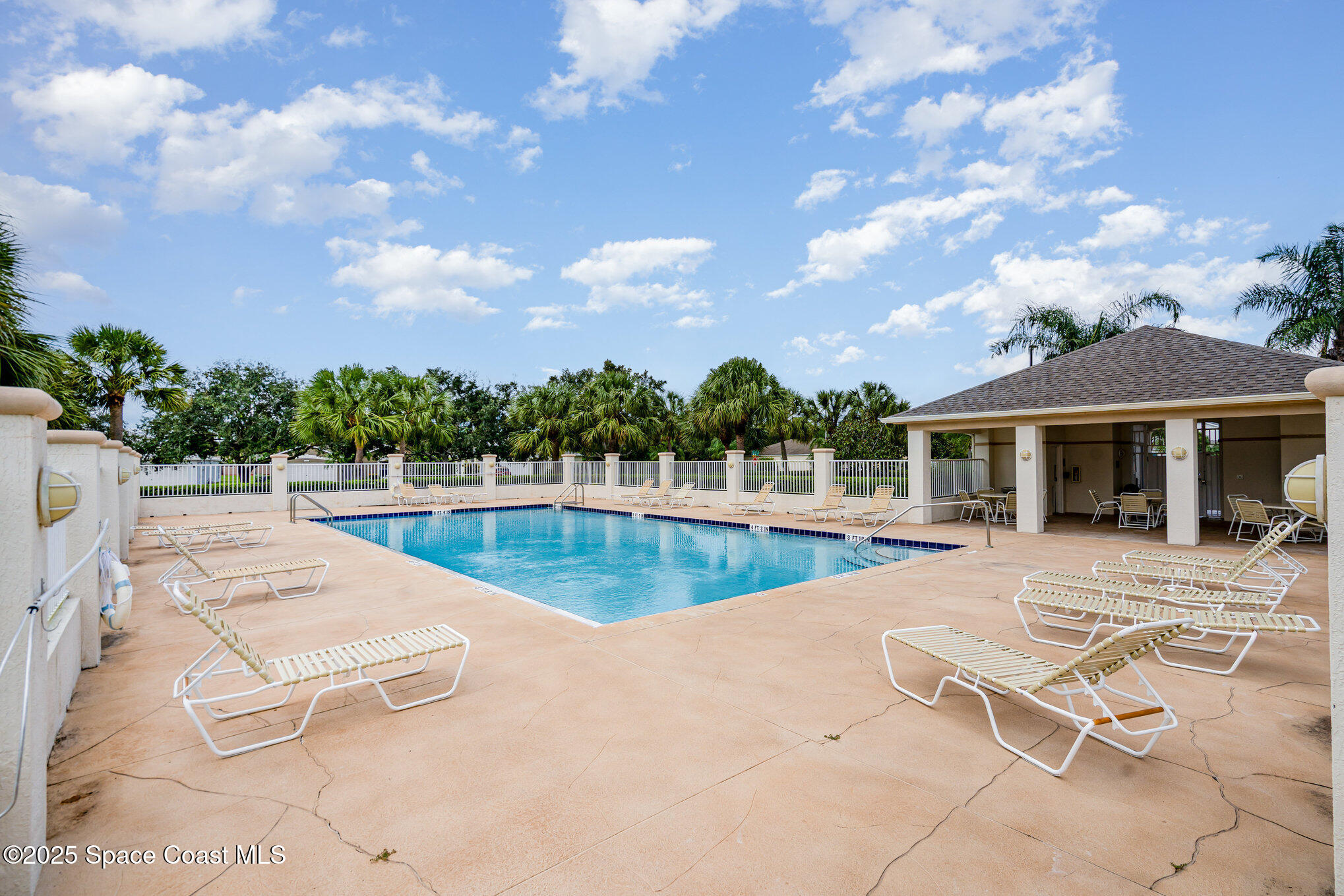 1162 Brumpton Place Rockledge, FL 32955 - Photo 22 of 25 a view of a house with swimming pool and sitting area