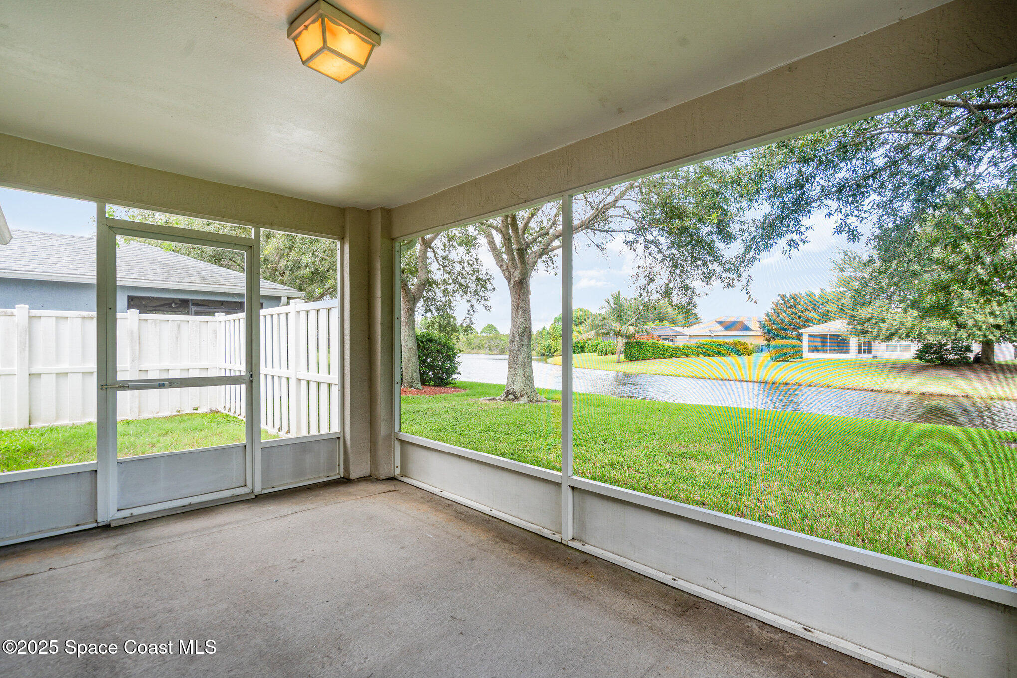 1162 Brumpton Place Rockledge, FL 32955 - Photo 3 of 25 a view of an empty room from a window