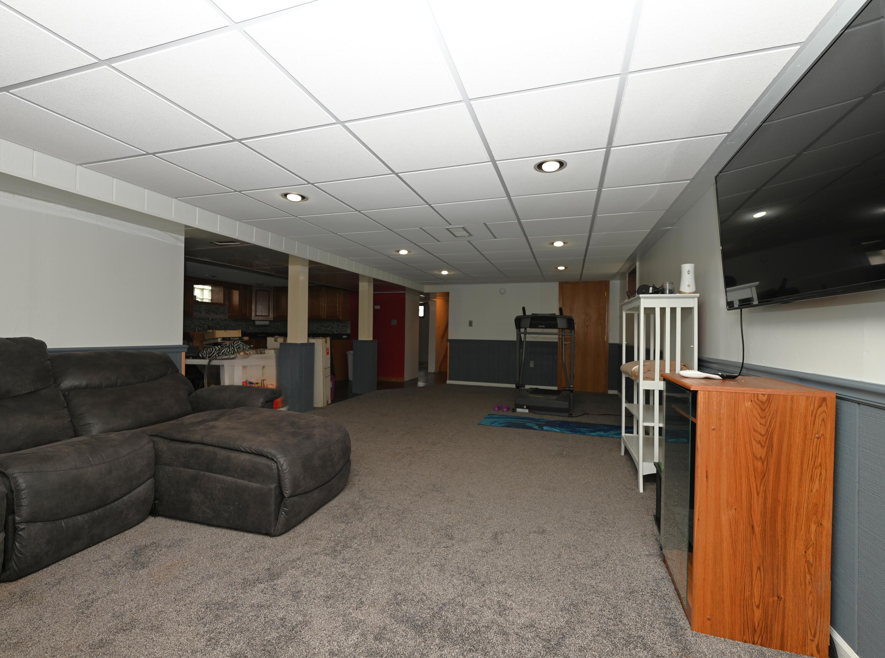 5110 West 400 North Winamac, IN 46996 - Photo 31 of 35 a living room with furniture and a flat screen tv