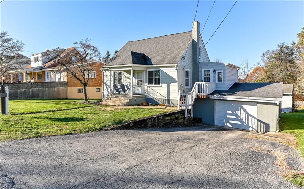 1711 Mercer Street Aliquippa, PA 15001 - Photo 23 of 27 a front view of a house with a yard