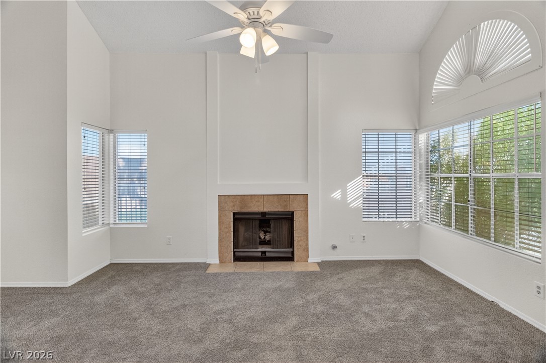 3156 Terrace View Drive Laughlin, NV 89029 - Photo 7 of 94 A grand living space with high ceilings and a cozy fireplace, perfect for gatherings.