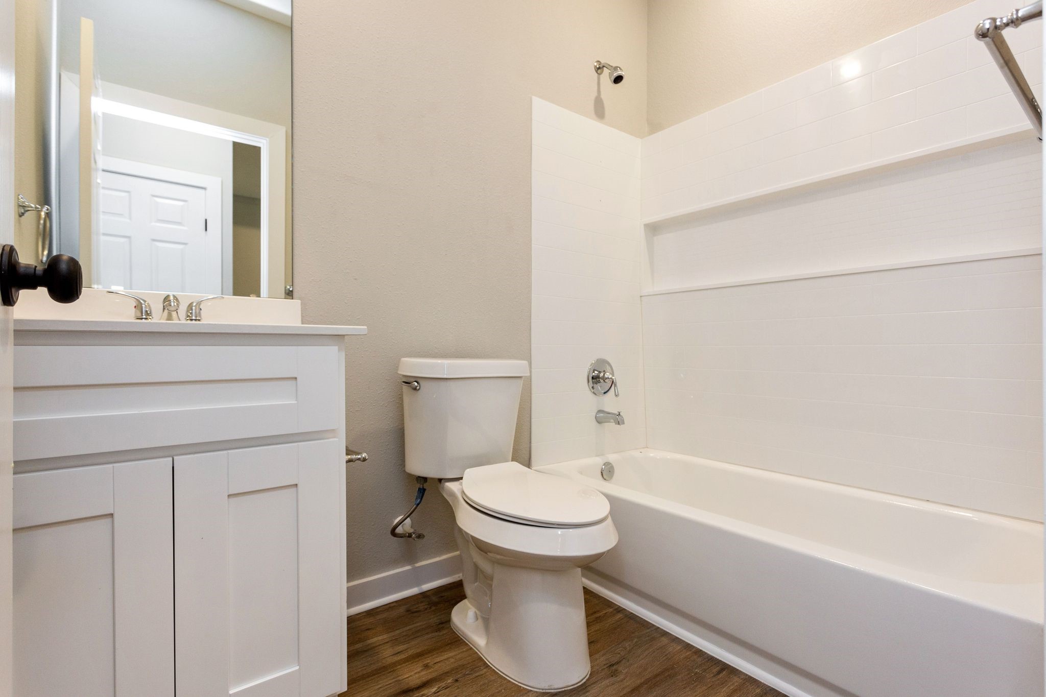 10317 Lake Road, Unit 15B Houston, TX 77070 - Photo 22 of 32 a bathroom with a sink a toilet and shower
