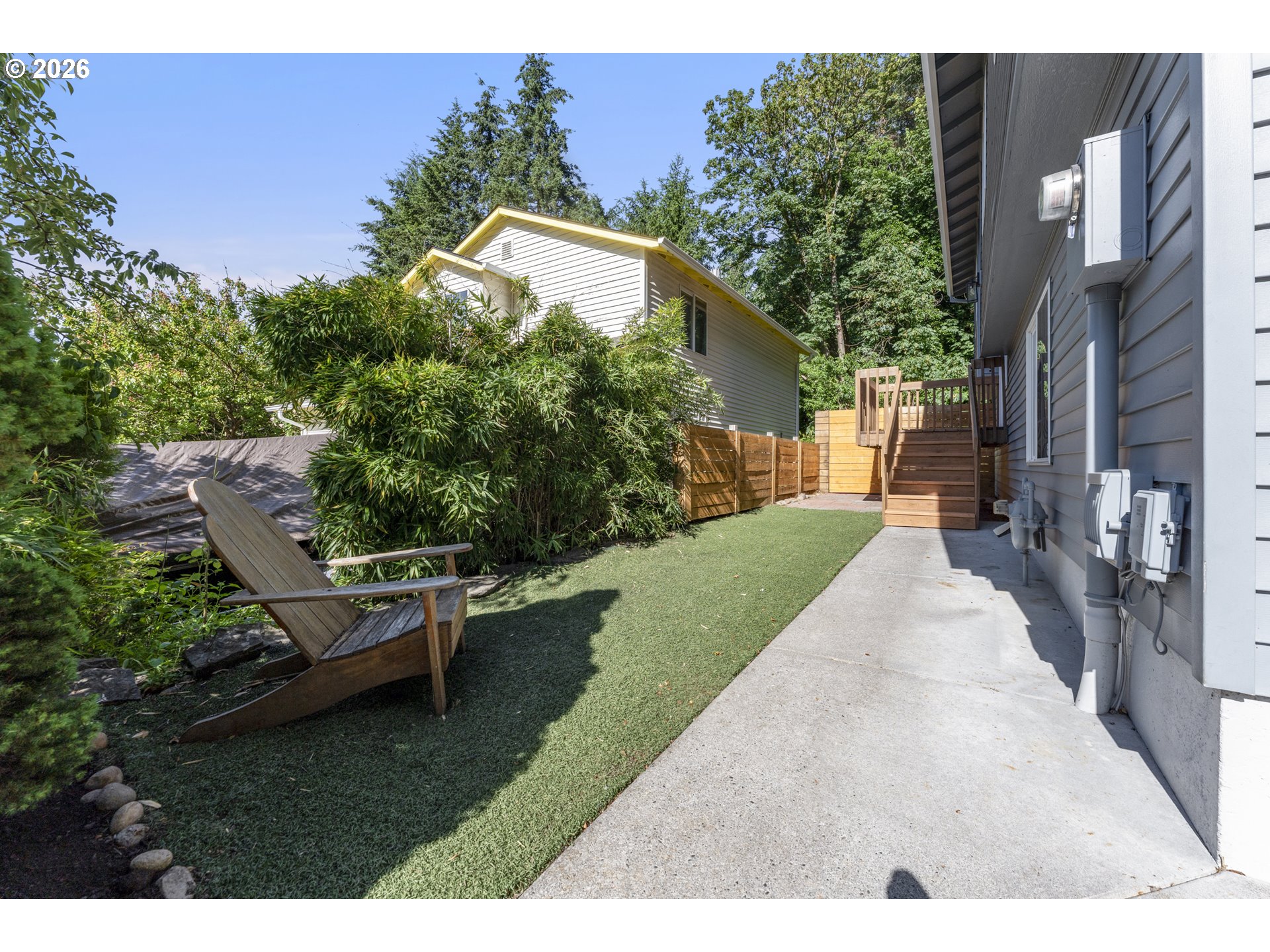 4024 Southeast 154th Place Portland, OR 97236 - Photo 36 of 43 a view of a backyard with plants and a patio