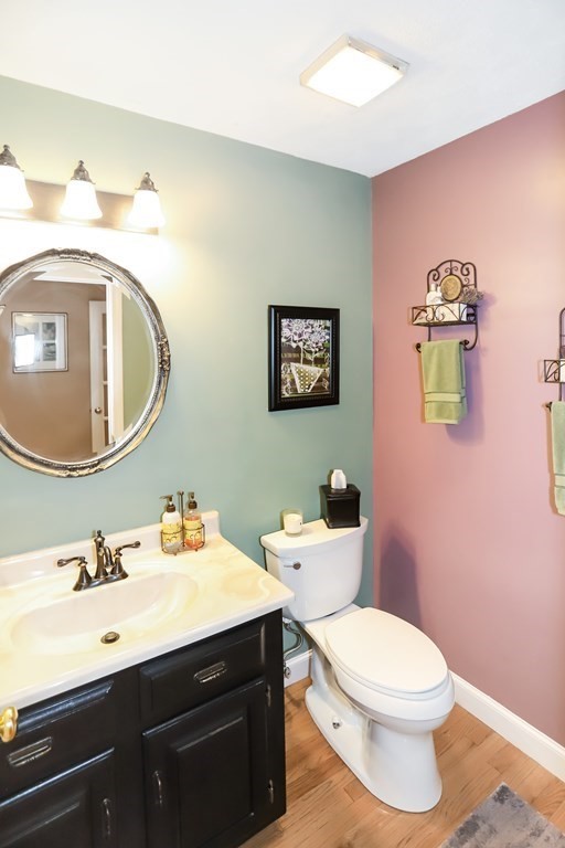 29 Lexington Drive, Unit 29 Atkinson, NH 03811 - Photo 15 of 31 a bathroom with a toilet a sink and mirror