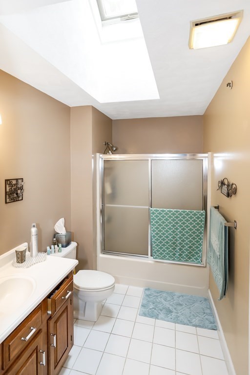 29 Lexington Drive, Unit 29 Atkinson, NH 03811 - Photo 23 of 31 a bathroom with a sink a toilet and shower