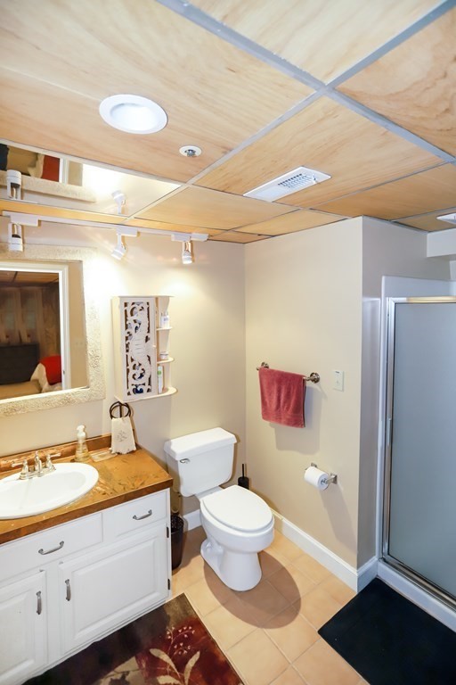 29 Lexington Drive, Unit 29 Atkinson, NH 03811 - Photo 28 of 31 a bathroom with a sink a toilet and shower