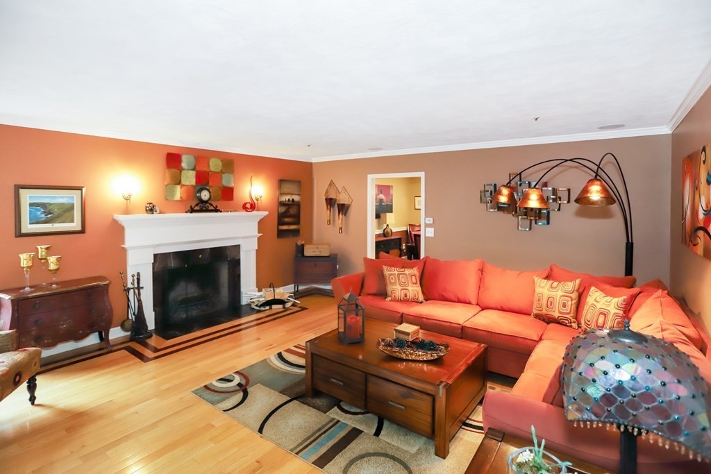 29 Lexington Drive, Unit 29 Atkinson, NH 03811 - Photo 6 of 31 a living room with furniture and a fireplace