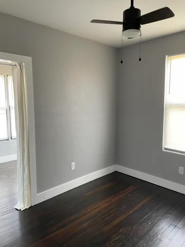 a bathroom with a toilet and a bathtub