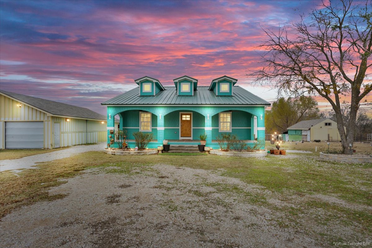 50 Dusty Dam Road Coupland, TX 78615 - Photo 2 of 38 The main residence sits peacefully on five acres, offering a true country setting with wide-open views.