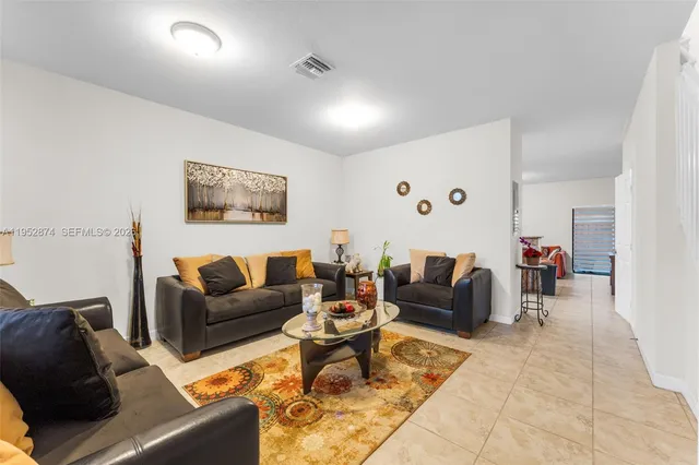 a living room with furniture and a couch