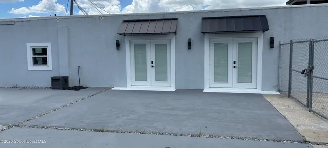 a view of empty room with windows