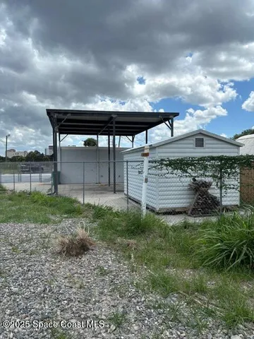 a view of backyard with green space