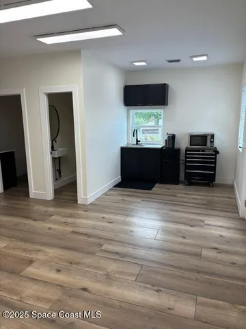 a bedroom with a bed and a television