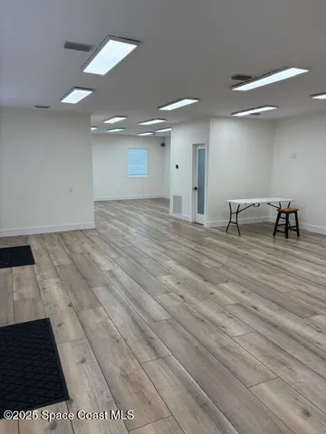 a view of wooden floor in an empty room