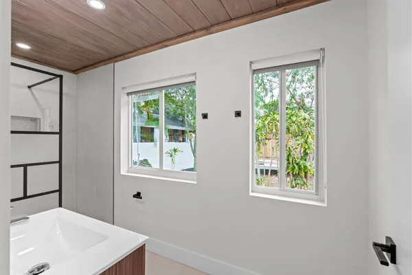 a bathroom with a sink and a window