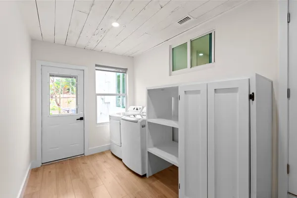 a view of kitchen with hardwood floor and window
