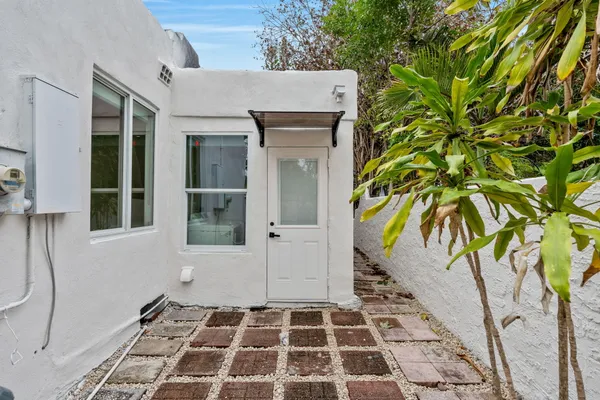 a view of a entryway door with wooden floor