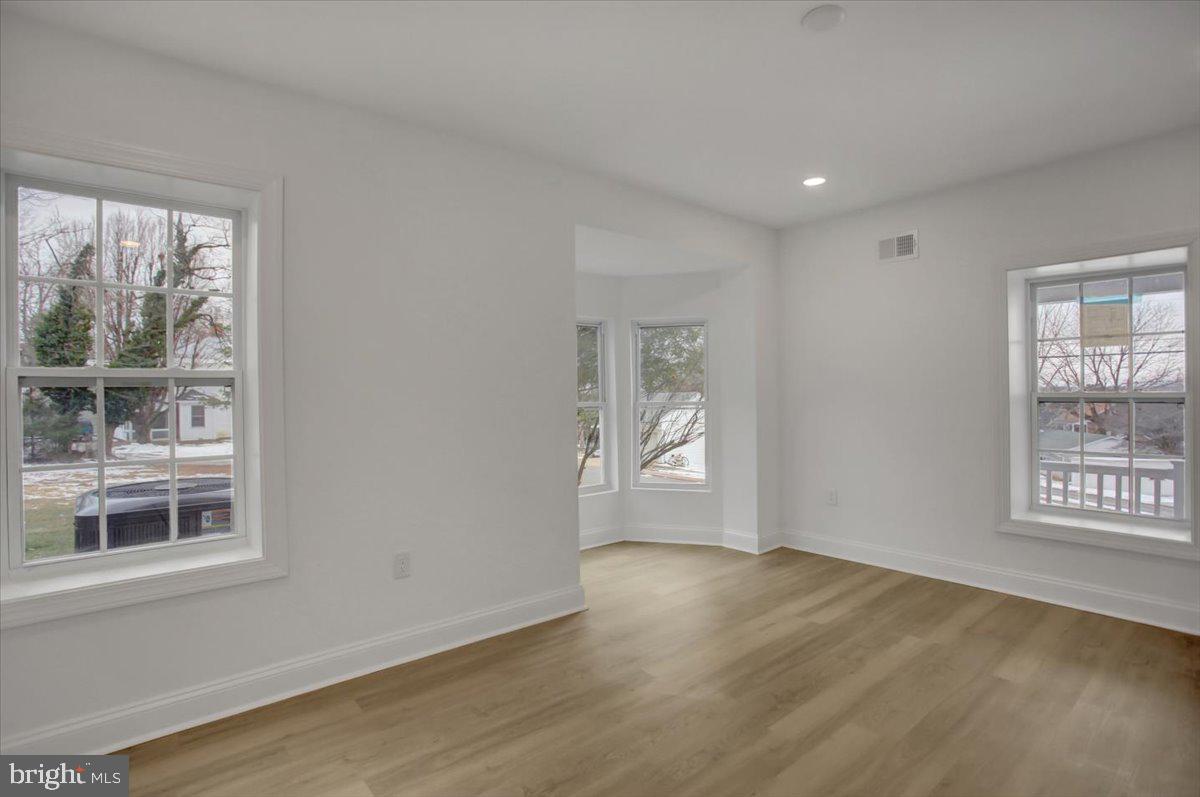 50 St Paul Street Boonsboro, MD 21713 - Photo 11 of 39 a view of empty room with wooden floor and fan
