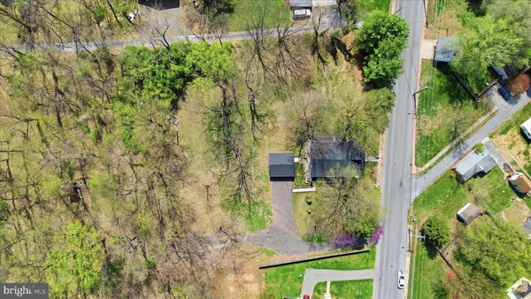 an aerial view of house with yard