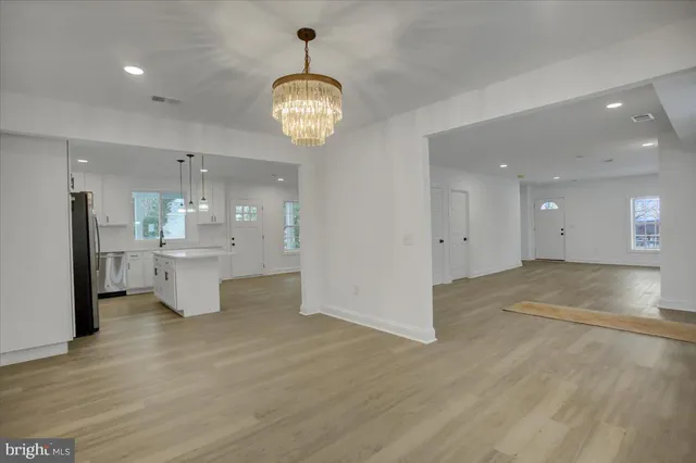 a view of a kitchen and a chandelier