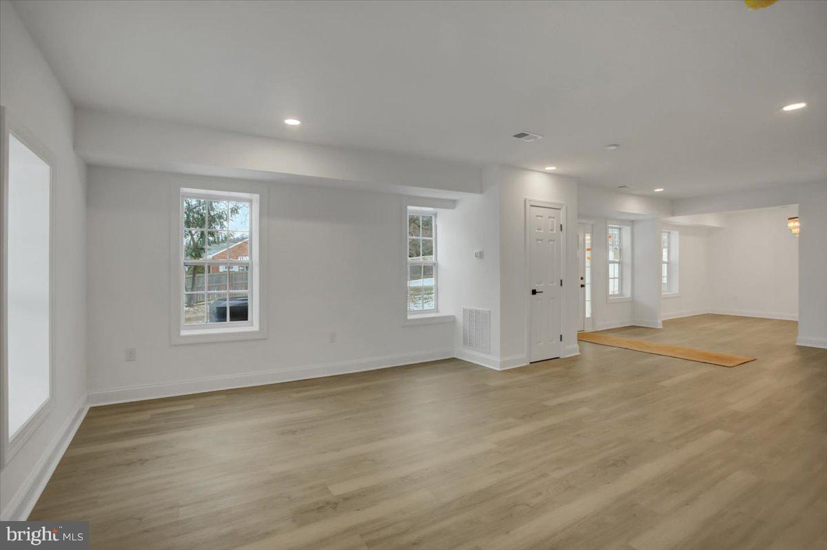50 St Paul Street Boonsboro, MD 21713 - Photo 13 of 81 a view of an empty room with wooden floor and a window