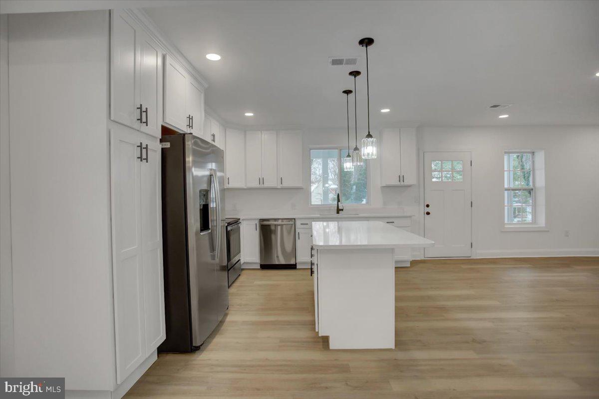 50 St Paul Street Boonsboro, MD 21713 - Photo 14 of 39 a large kitchen with a lot of counter space and stainless steel appliances